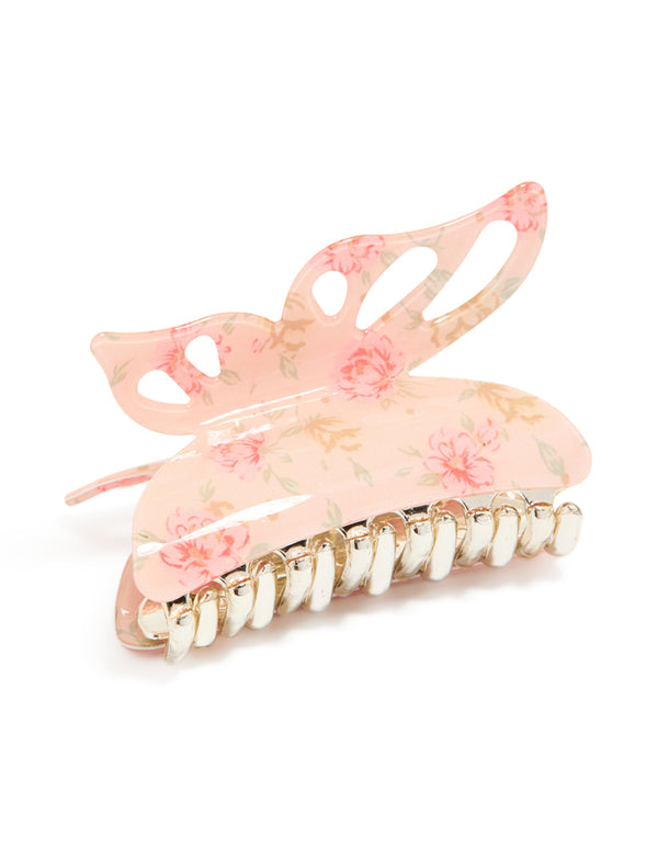 Showcasing an acrylic claw clip with butterfly design and floral print in light pink, peachpuff, gold, tan detail view