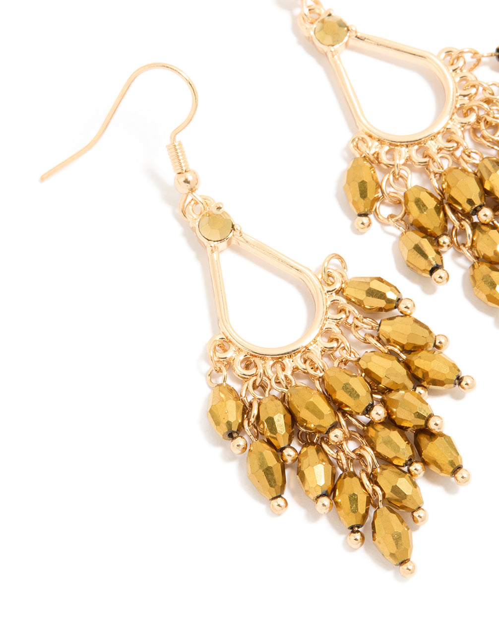 Featuring statement gold irregular beaded drop earrings with charm accents close up view