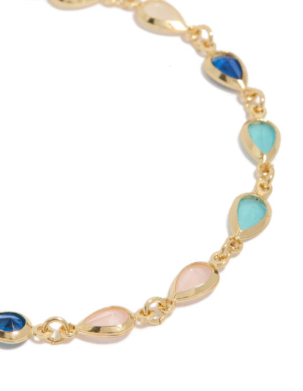 Designed with gold plated bracelet showcasing pink and blue cubic zirconia stones in dainty style close up view