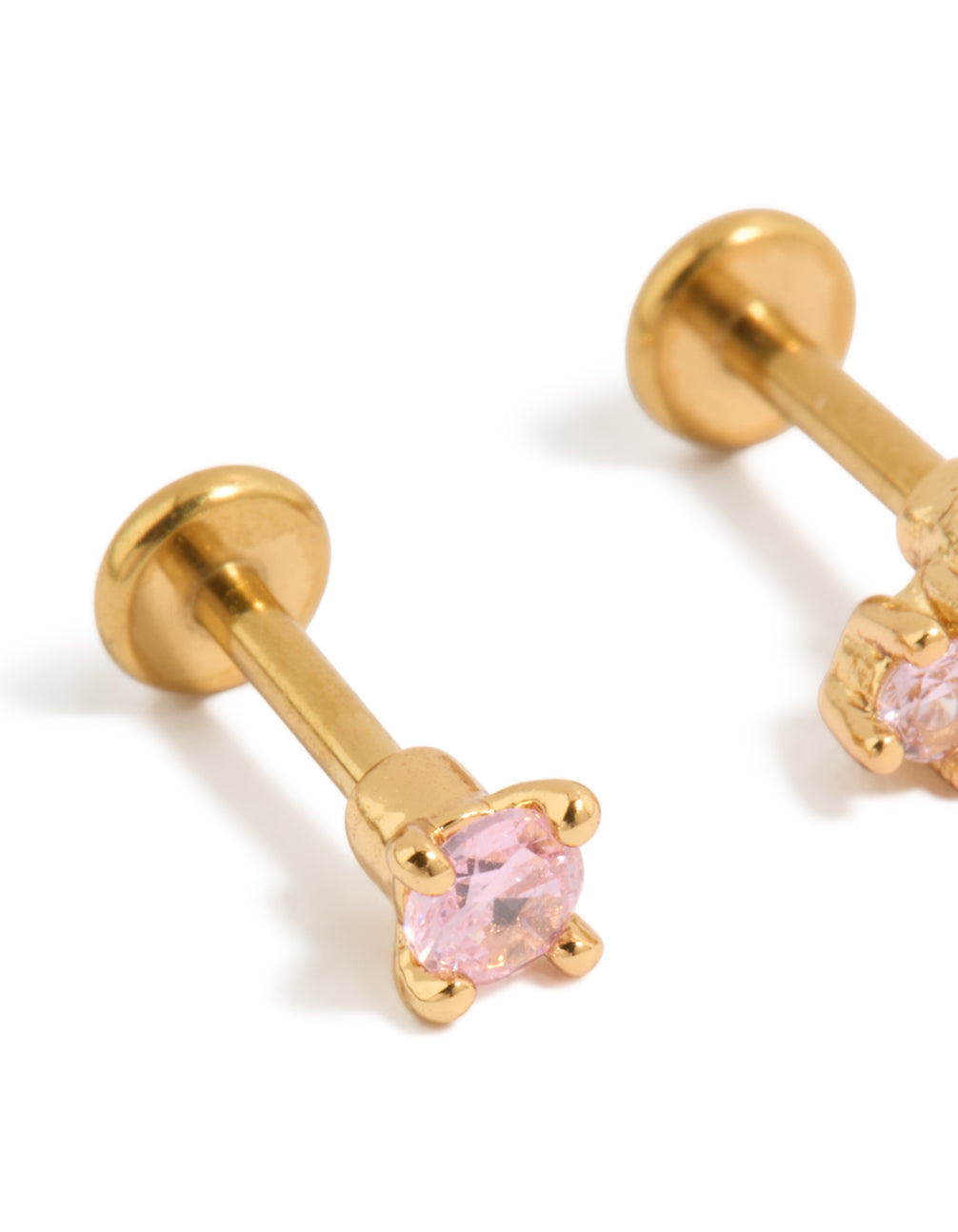 Detailed view of gold plated titanium pink cubic zirconia flat back studs featuring crystal in gold close up view