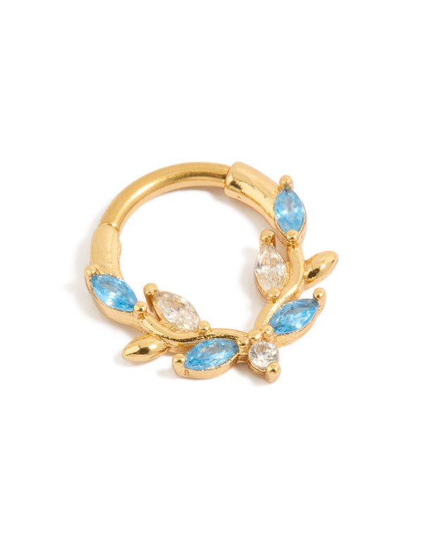 Showcasing vine design gold plated titanium clicker ring with blue cubic zirconia front view
