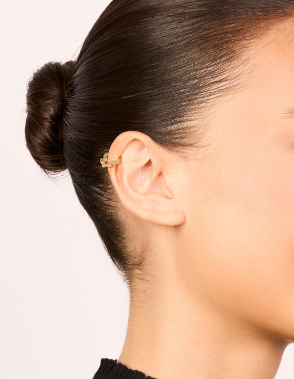 Featuring gold plated titanium pink cubic zirconia vine clicker ring with statement on ear view