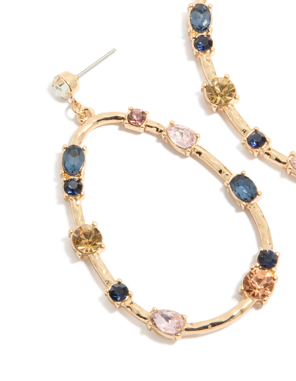 Featuring statement earrings in an oval stone cut with blue, pink, and clear diamantes set in a gold open drop design close up view