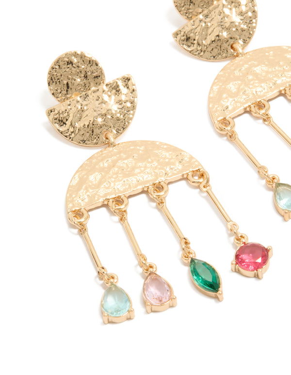 Featuring worn gold pink and green diamantes drop earrings with charm statement detailing close up view