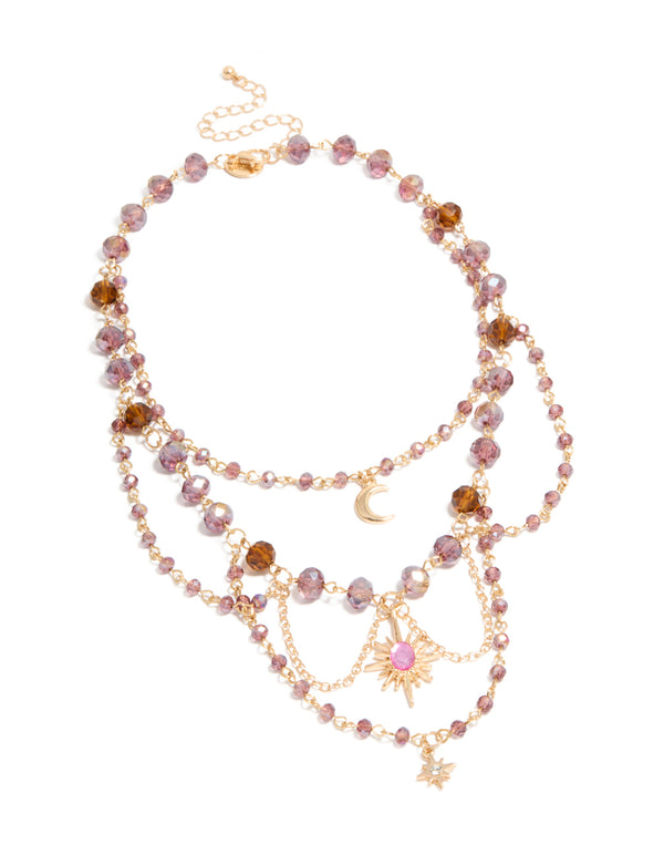 Showcasing a gold purple beaded celestial draped layered necklace with charm pendant moon and star front view