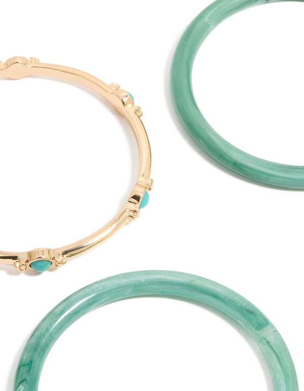Discover this gold and blue acrylic bangles 4-pack with beads in turquoise and aqua close up view