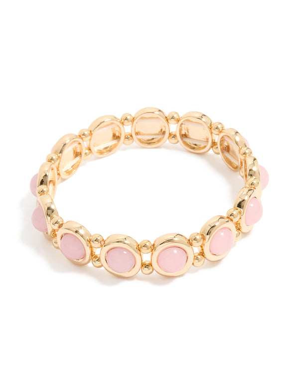 Discover this beaded organic shaped stretch bracelet in gold and pink front view