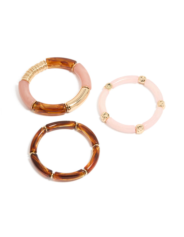 Showcasing a beaded charm stretch bracelet 3-pack crafted from resin in pink and gold front view