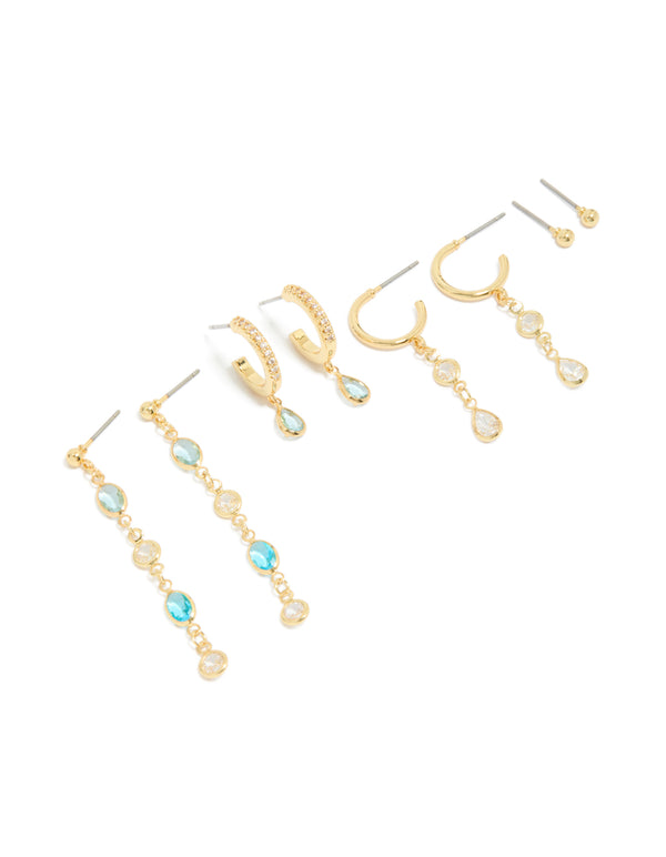 Beautifully arranged gold plated blue and clear cubic zirconia stacking earrings 4-pack featuring crystal huggie and stud closures front view