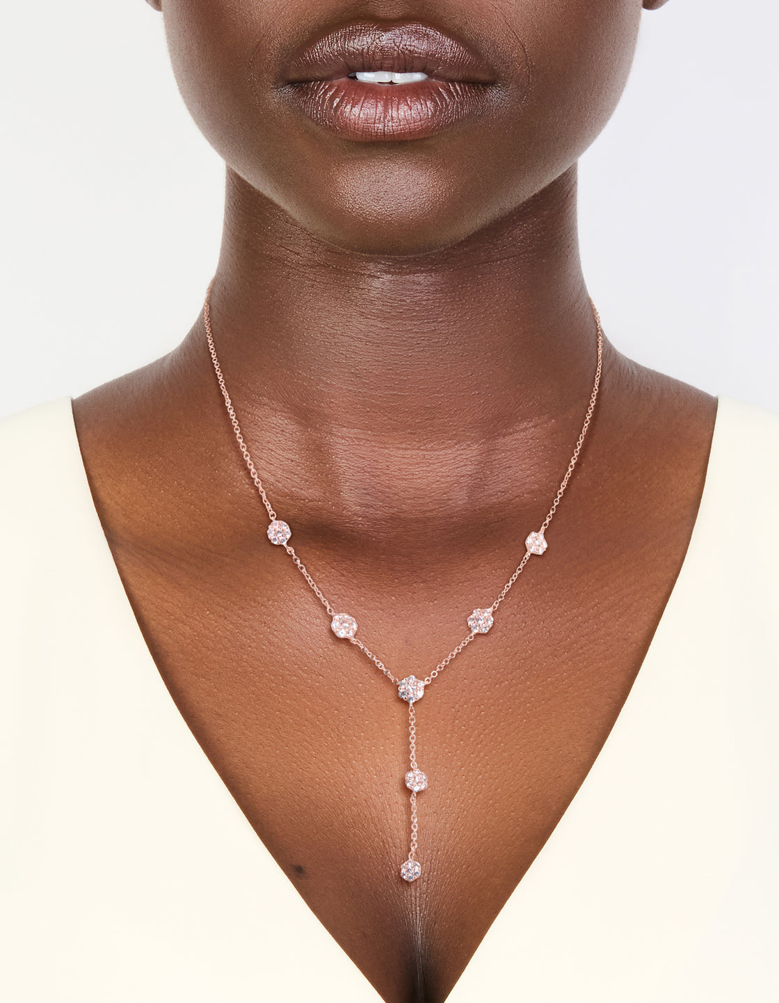 Delicate rose gold cubic zirconia mini floral Y-necklace dainty style, on neck view