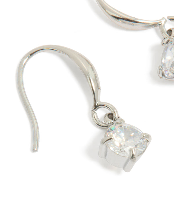 Featuring waterproof stainless steel sleek drop earrings with round cut cubic zirconia in silver and clear close up view