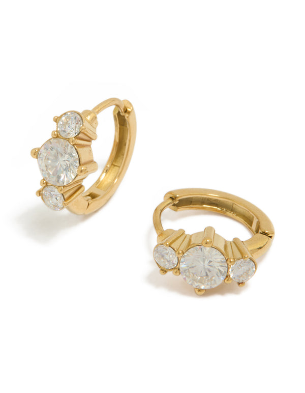 Showcasing dainty huggie earrings crafted from waterproof gold plated stainless steel with cubic zirconia trio stones in clear front view