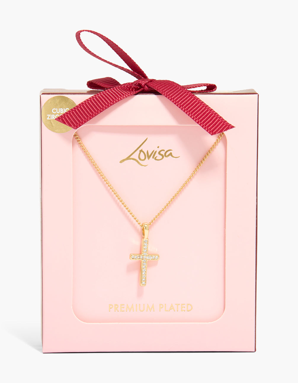 Showcasing a gold plated cubic zirconia cross pendant necklace with dainty styling shown in a packaging close up view