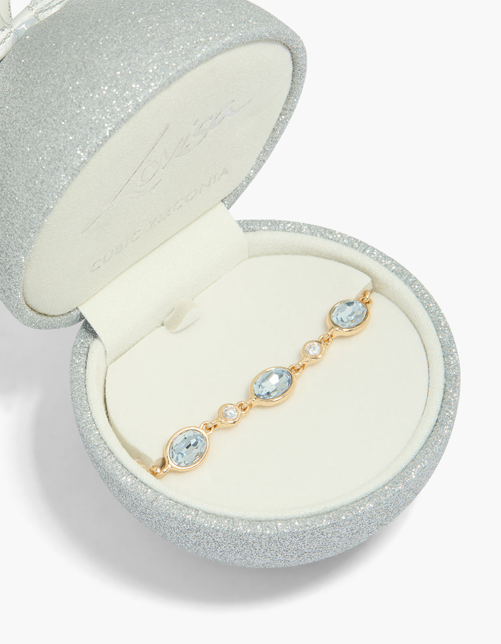 Beautifully crafted bracelet with oval and circle cubic zirconia in gold close up view