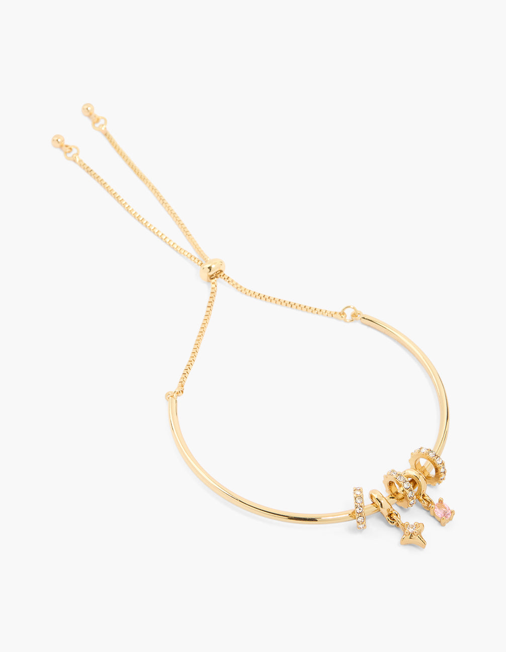 Beautifully crafted gold plated small cubic zirconia star bracelet featuring celestial charm details with crystal accents and oval stone in light pink front view