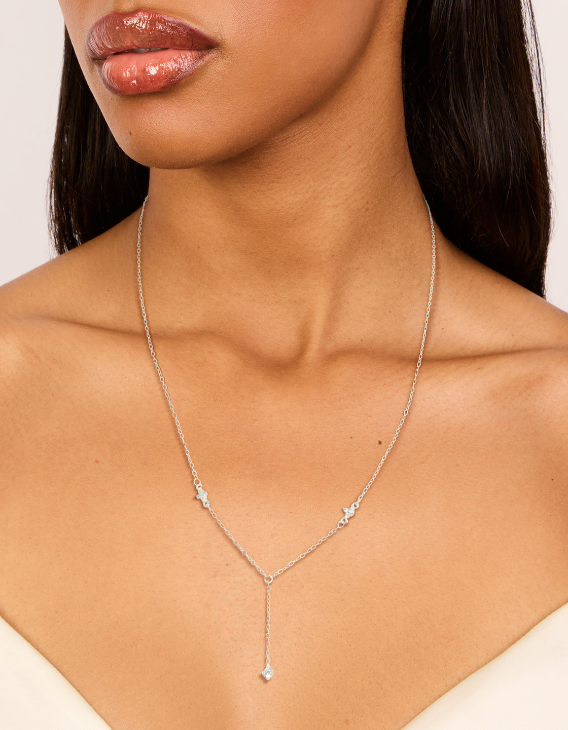 Beautifully crafted dainty sterling silver cubic zirconia flower Y-necklace featuring floral details on neck view
