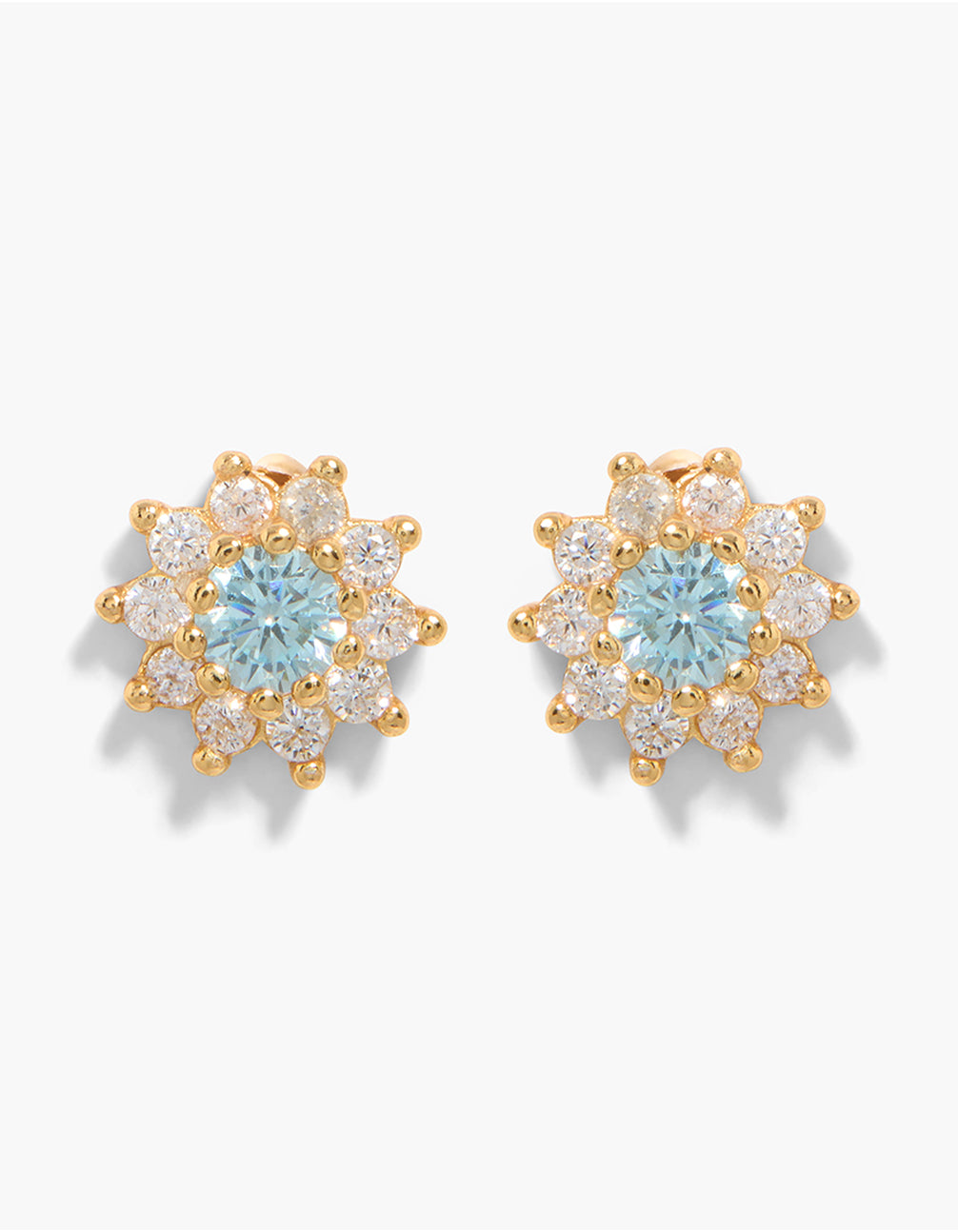 Beautifully crafted stud earrings featuring floral with halo stone cut, cubic zirconia crystal in sterling silver, gold and powder blue color front view