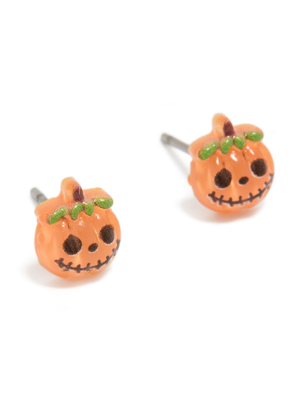 Featuring orange acrylic pumpkin skull face stud earrings with food theme in green, black, and brown front view