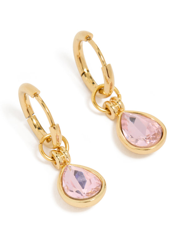 Featuring waterproof gold plated stainless steel pink cubic zirconia pear drop huggie earrings with crystal details front view