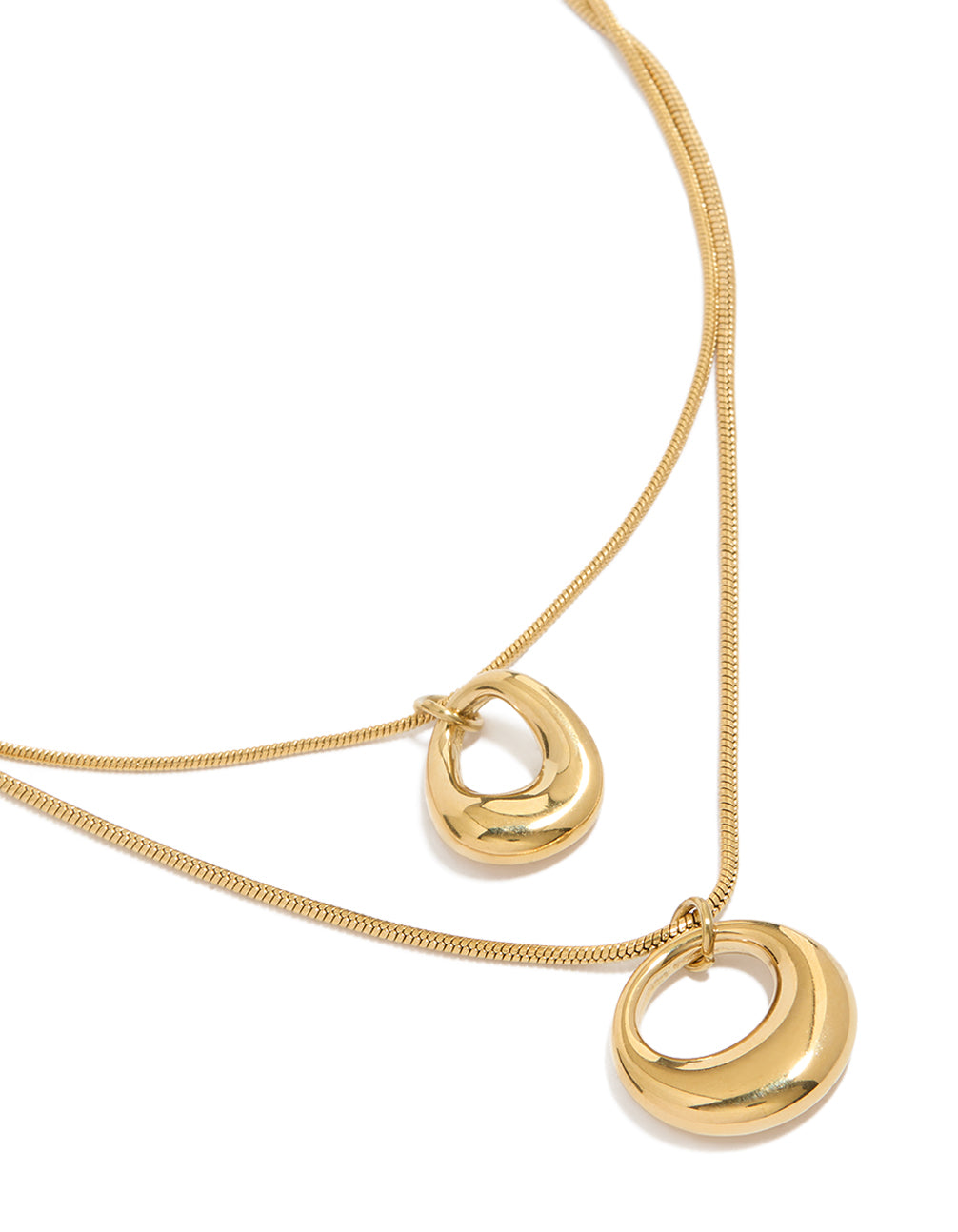 Showcasing a waterproof gold plated stainless steel open round pendant layered necklace in chunky style close up view