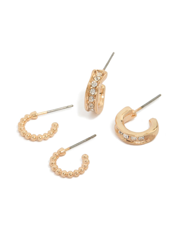 Showcasing gold bubble and diamante huggie earrings in a 2-pack with huggie closure front view