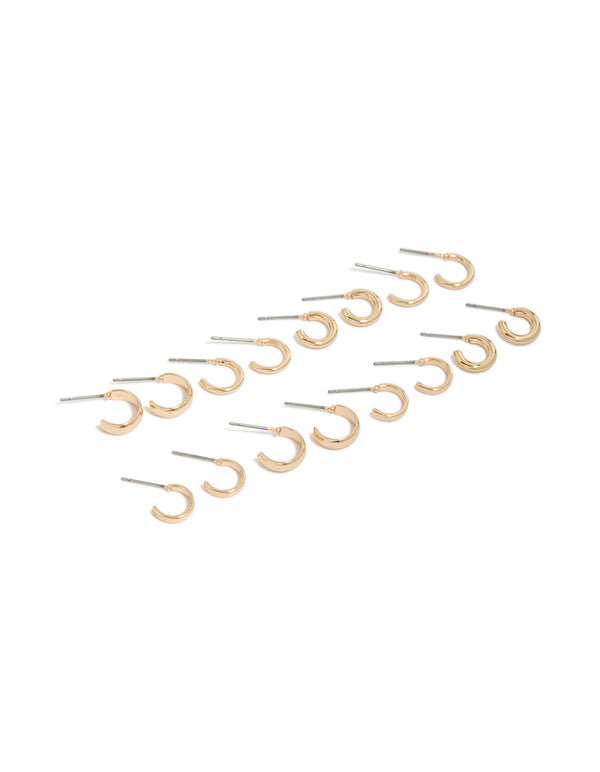 Showcasing gold plain open hoop earrings in an 8-pack with silver posts front view
