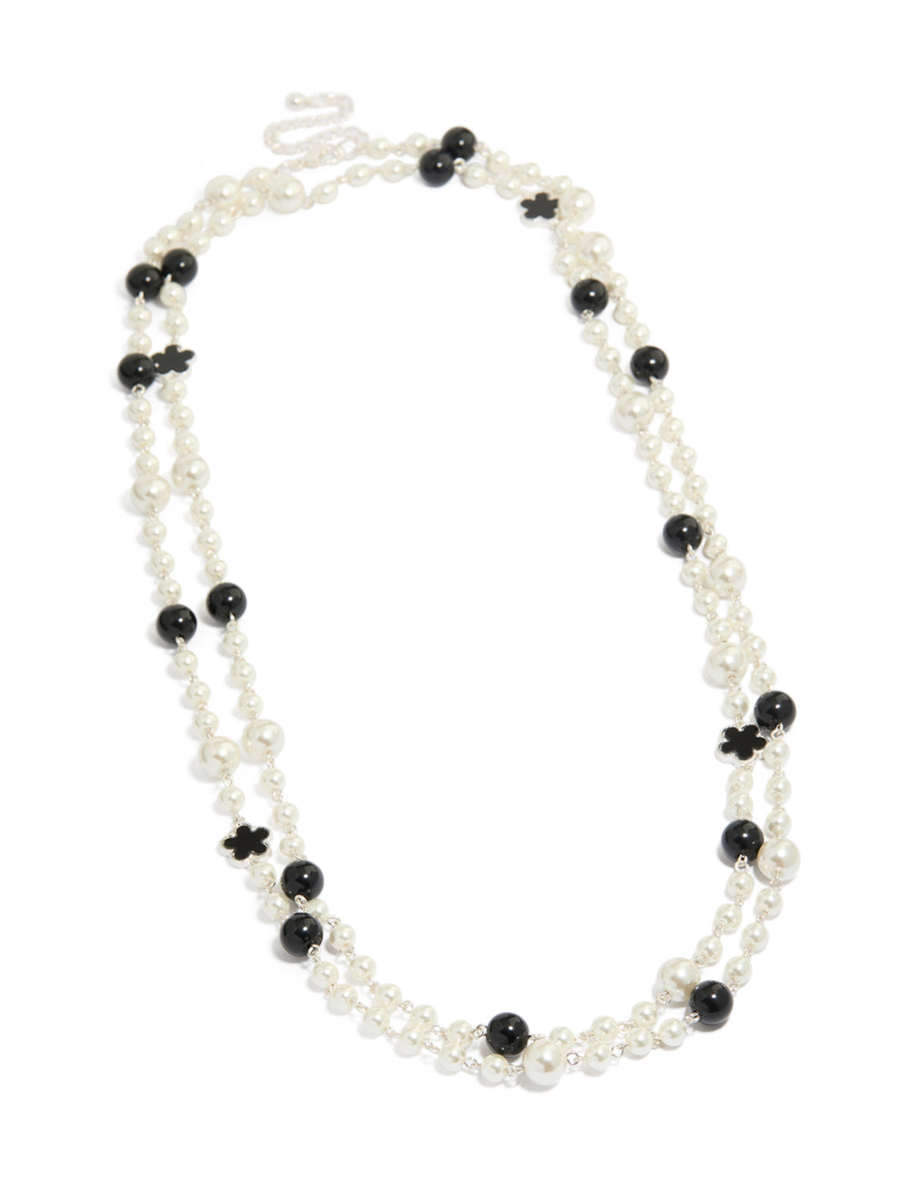 Highlighting a beaded pearl and flower layered necklace in ivory, black, and silver front view