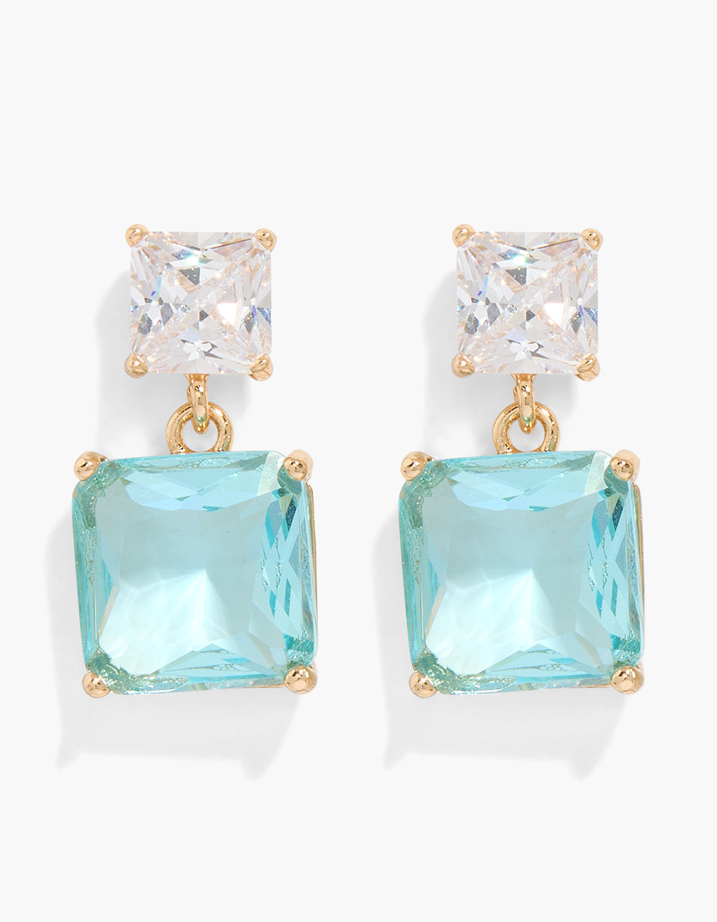 Showcasing statement double drop earrings with charm detailing, featuring light blue and clear cubic zirconia crystals set in gold, front view