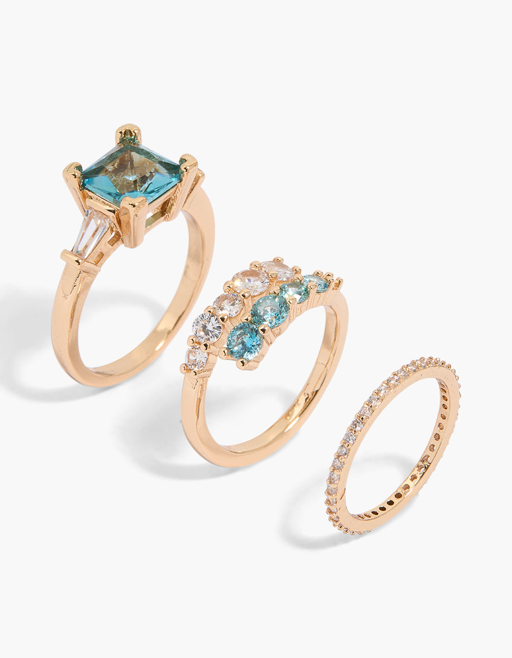 Discover this statement 3-pack of gold rings featuring crystal and cubic zirconia in blue, aqua, and clear stones front view