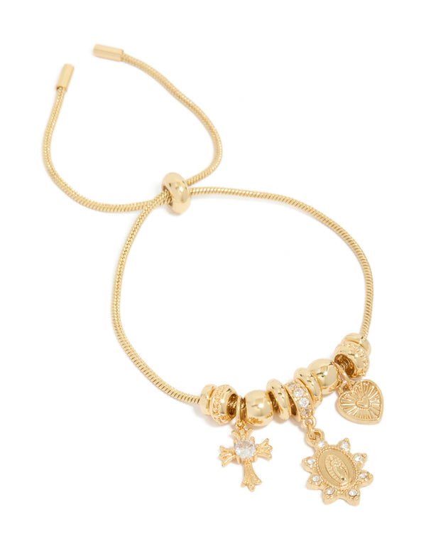 Showcasing a gold plated cubic zirconia heart and cross toggle bracelet with beads and charm details front view