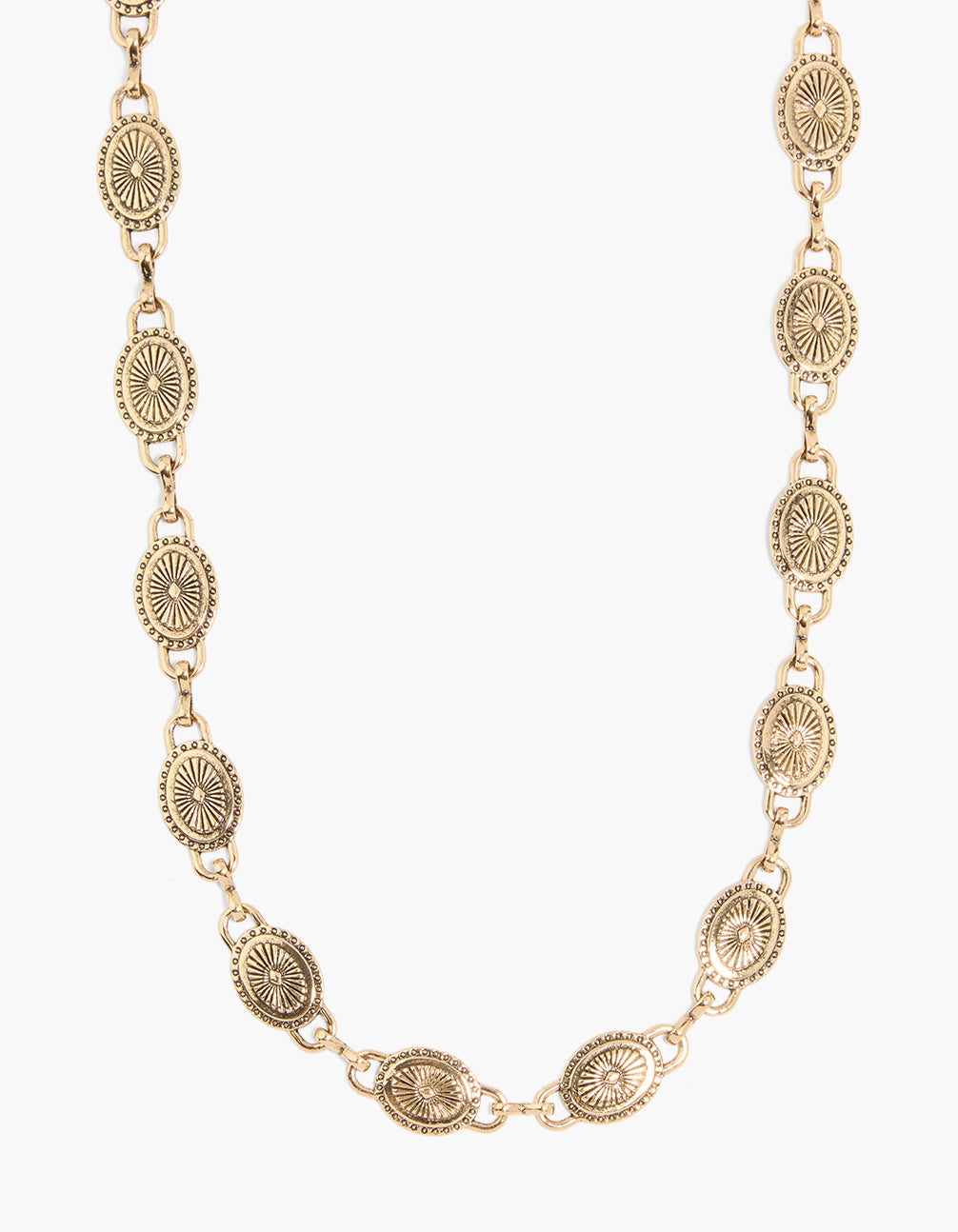 Showcasing an antique gold mini disc western belt with embellished waisted design in statement style detail view