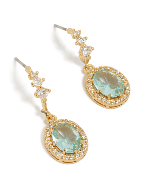 Elegant drop earrings in gold plated finish featuring blue cubic zirconia with oval halo stone cut front view