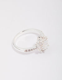 Showcasing a silver plated regal pear ring with stone cut detail front view - link has visual effect only