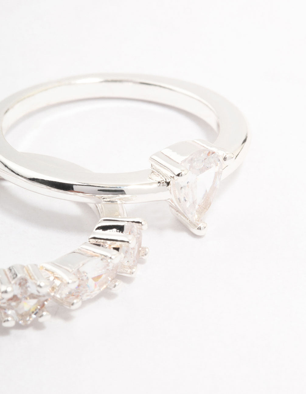 Beautifully crafted silver plated alternating pear stacking rings featuring stone cut gemstones close up view
