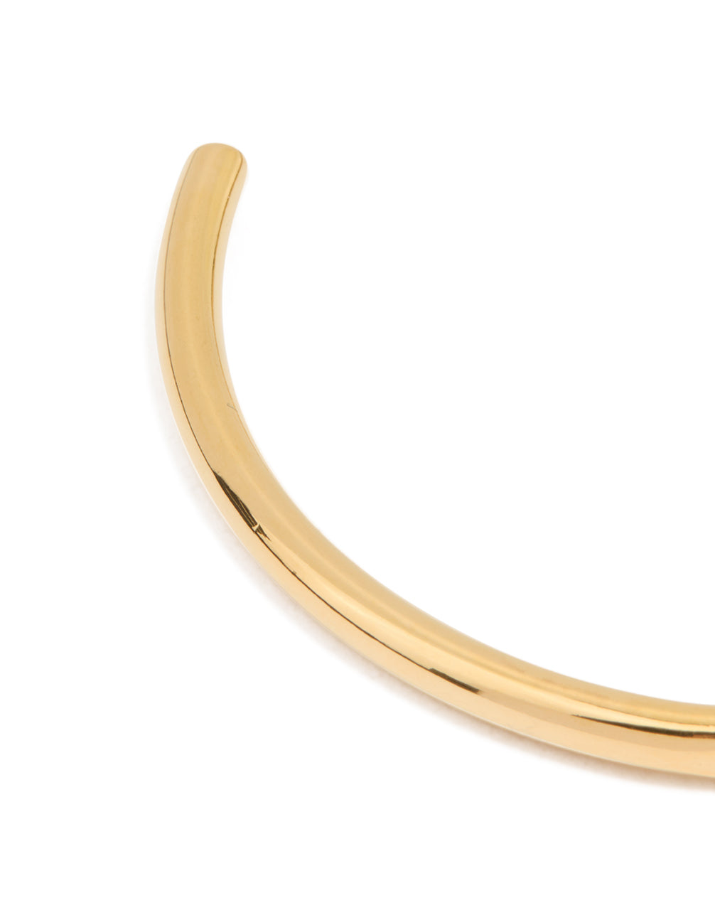 Designed with waterproof gold plated stainless steel, this slim wrist cuff bangle in gold closure detail view