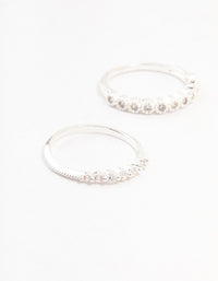 Featuring silver plated fine round cubic zirconia stackable rings in a 3-pack close up view - link has visual effect only