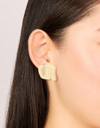 Showcasing gold plated curved square stud earrings on ear view - link has visual effect only