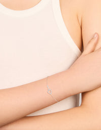 Elegantly designed sterling silver infinity and cubic zirconia heart link bracelet in silver on wrist view - link has visual effect only