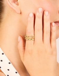 Showcasing waterproof gold plated stainless steel organic rings in a 3-pack on finger view - link has visual effect only