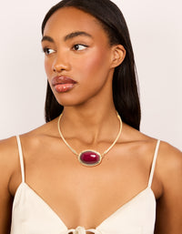 Crafted in gold with red large stone and tube design, this necklace is shown in crimson on model view - link has visual effect only