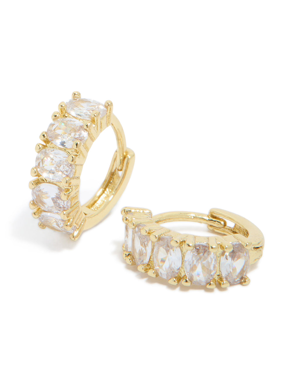 Showcasing gold plated cubic zirconia oval huggie earrings with prong settings in clear and gold front view