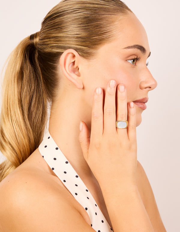 Showcasing a celestial waterproof gold plated stainless steel square semi precious moonstone signet ring with chunky design on finger view