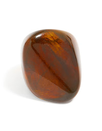Highlighting a dark brown acrylic large obtuse ring in chunky statement style close up view - link has visual effect only
