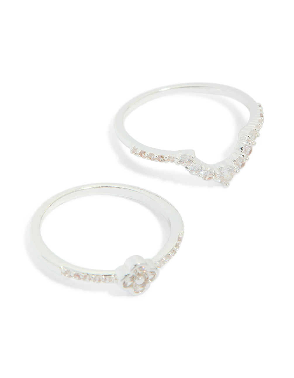 Featuring silver plated cubic zirconia dainty flower and band stacking rings 3-pack with white close up view