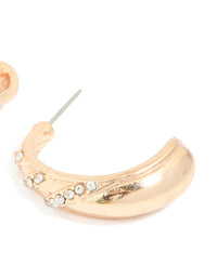 Detailed view of gold diamante pear open hoop earrings showcasing white crystal settings and post detail view - link has visual effect only