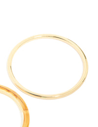Featuring gold plated acrylic bangles in a 2-pack close up view - link has visual effect only