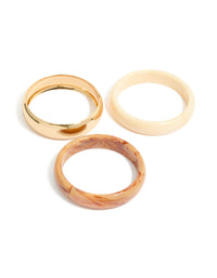Featuring gold and neutral acrylic bangles in a 3-pack bracelet set front view - link has visual effect only