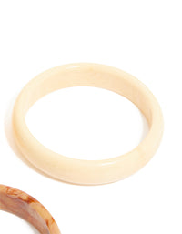 Designed with gold and neutral acrylic 3-pack bangles in bracelet set closure detail view - link has visual effect only