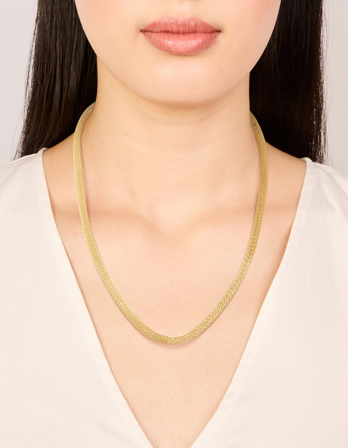 Showcasing a waterproof gold plated stainless steel mesh tube necklace on neck view