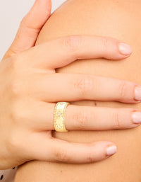 Featuring a waterproof gold plated stainless steel ring with cubic zirconia celestial star thick band on finger view - link has visual effect only